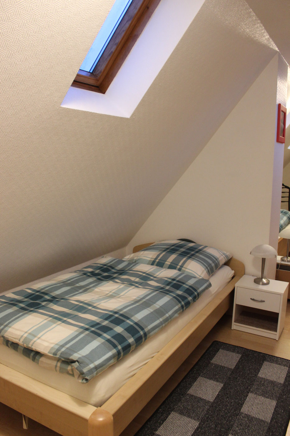 Bed in the attic studio