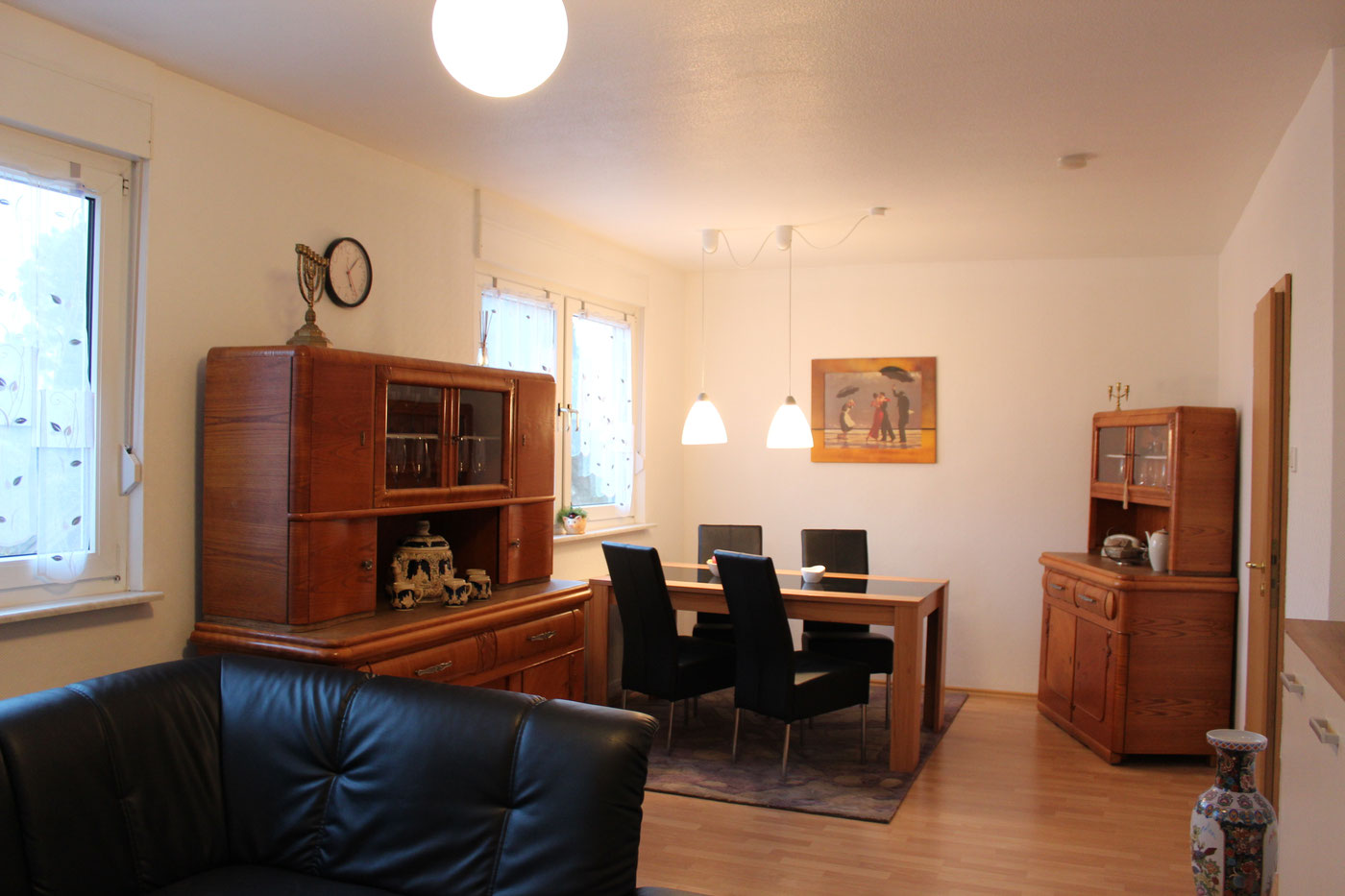 Living and dining room in the upper-floor apartment