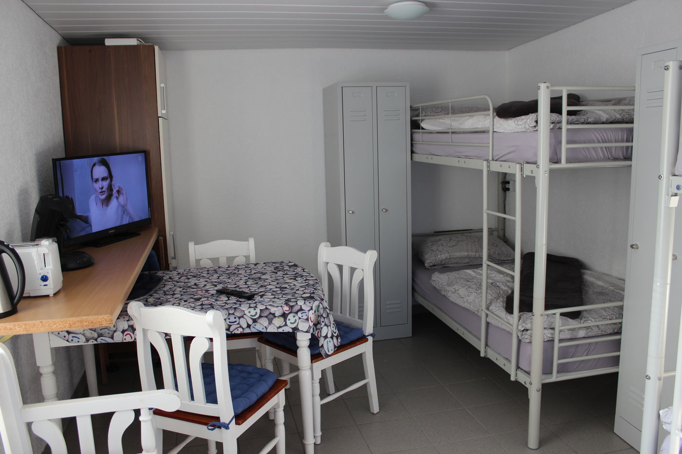 Guest room with bunk beds and dining area